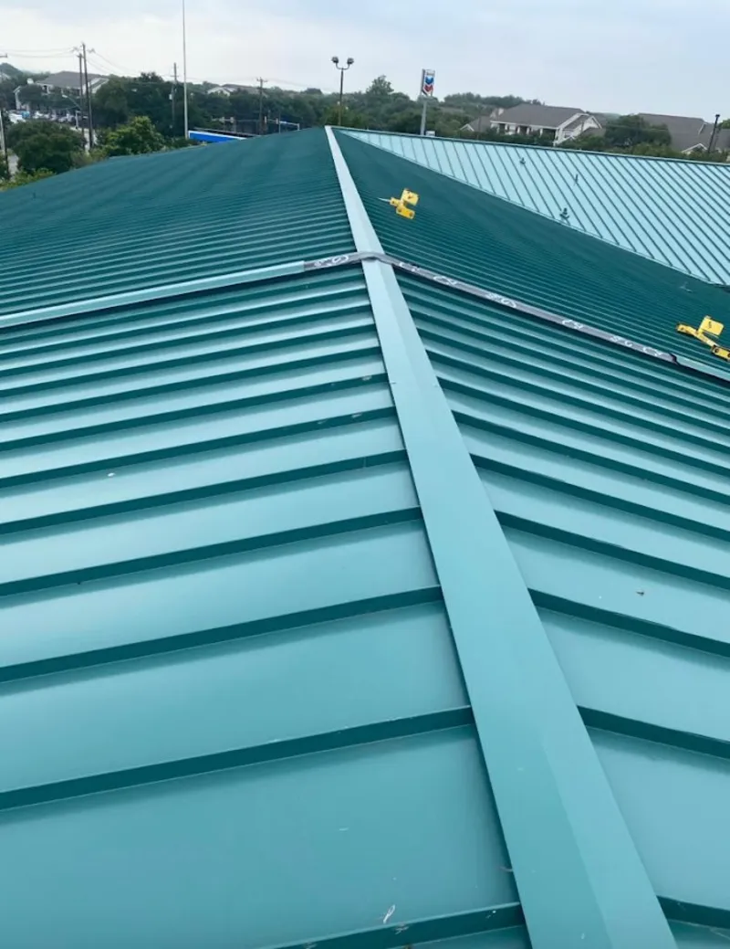 Green commercial metal roof ridge and valley for Metal Roof Repair in Moberly
